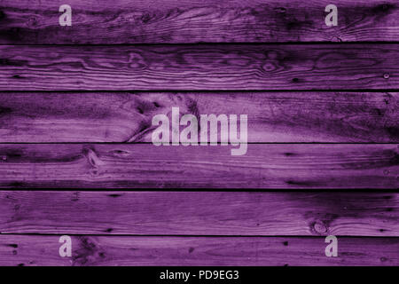 Close-up of the surface (wall, floor or overhead) made of wooden plank, panel or board in the purple, ultra violet shade Stock Photo