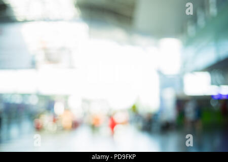Blurred people in airport. Defocused modern background.