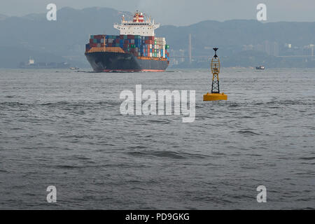 Container Ship KOTA LUKIS, Leaves The Kwai Tsing Container Terminals In Hong Kong, China And Heads Towards The East Lamma Channel. Stock Photo