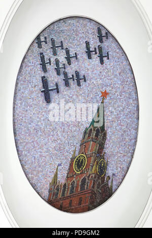 Soviet aeroplanes flying over the Spasskaya Tower (Saviour Tower) of the Moscow Kremlin depicted in the ceiling mosaic designed by Soviet artist Alexander Deyneka in the Mayakovskaya metro station in Moscow, Russia. One of the mosaics from the set entitled Twenty-four Hours in the Soviet Sky assembled by Russian mosaic master Vladimir Frolov in the 1930s. Stock Photo