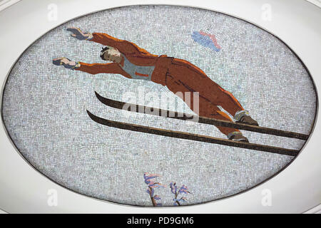 Ski jumper depicted in the ceiling mosaic designed by Soviet artist Alexander Deyneka in the Mayakovskaya metro station in Moscow, Russia. One of the mosaics from the set entitled Twenty-four Hours in the Soviet Sky assembled by Russian mosaic master Vladimir Frolov in the 1930s. Stock Photo