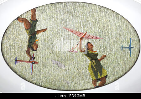 Soviet pioneers are engaged aeromodelling depicted in the ceiling mosaic designed by Soviet artist Alexander Deyneka in the Mayakovskaya metro station in Moscow, Russia. One of the mosaics from the set entitled Twenty-four Hours in the Soviet Sky assembled by Russian mosaic master Vladimir Frolov in the 1930s. Stock Photo