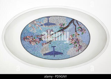 Two Soviet aeroplanes flying over the blooming apple tree depicted in the ceiling mosaic designed by Soviet artist Alexander Deyneka in the Mayakovskaya metro station in Moscow, Russia. One of the mosaics from the set entitled Twenty-four Hours in the Soviet Sky assembled by Russian mosaic master Vladimir Frolov in the 1930s. Stock Photo