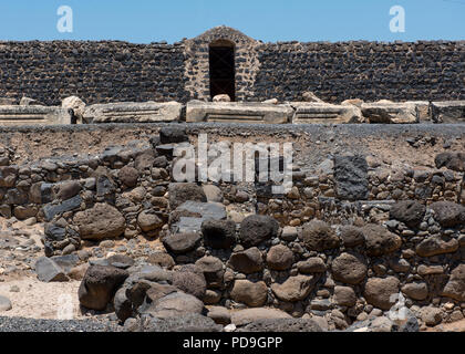 Surrounding wall of the ruins of the dark basalt rock village of Capernaum, on the shore of the Sea of Galilee, where Jesus and St Peter lived and met Stock Photo