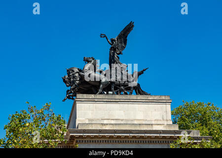 London England August 05, 2018 Statue of a Quadriga, an ancient four horsed chariot, on top of the Wellington Memorial Arch, at Hyde Park Corner Stock Photo