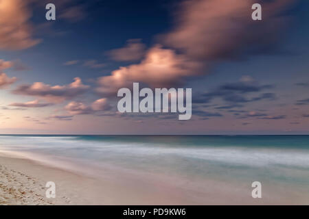 Afterglow with clouds by the sea, Playa Bavaro, Punta Cana, Dominican Republic Stock Photo