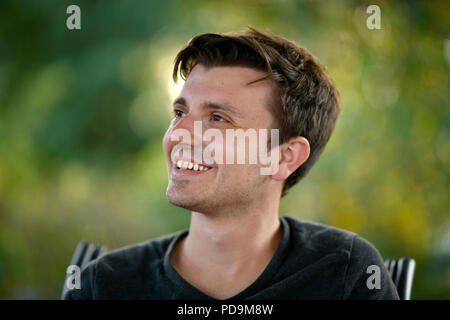 Young man, smiling, portrait, Germany Stock Photo