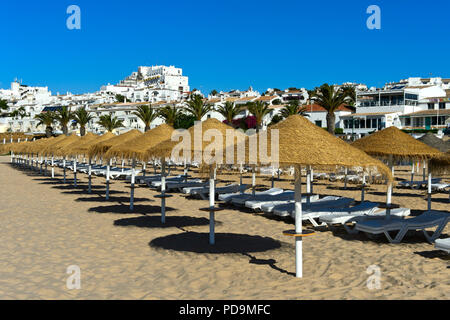 Sun beds on the beach, Praia da Luz, Algarve, Portugal Stock Photo