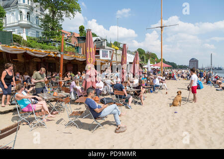 Many people in the restaurant on Elbe beach, beach bar Strandperle, Övelgönne, Elbe, Altona, Hamburg, Germany Stock Photo