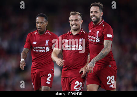 Liverpool's (left-right) Fabinho, Xherdan Shaqiri, and Danny Ings celebrate Daniel Sturridge (not pictured) scoring his side's third goal of the game during the pre-season match at Anfield, Liverpool Stock Photo