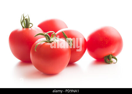 Tasty red tomatoes isolated on white background. Stock Photo