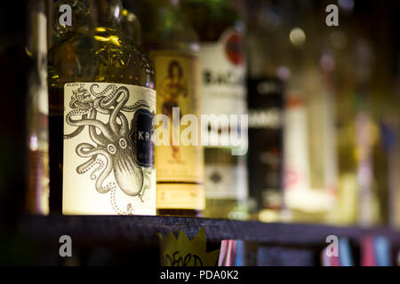 Bottles of spirits on a shelf in a bar in Bradford, UK Stock Photo