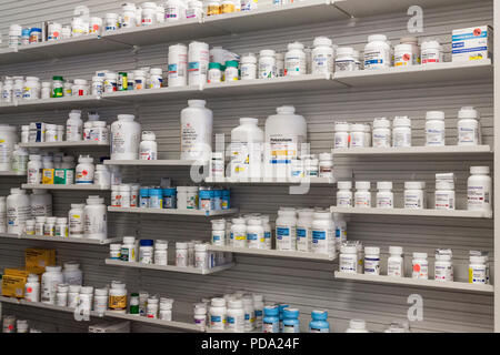 Medicines arranged on shelves at pharmacy