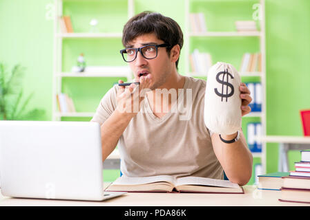 Young student in expensive tuition concept Stock Photo