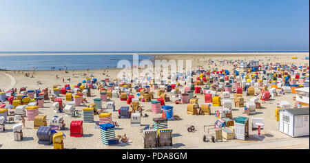 Panorama of many colorful tents and beach chairs on Borkum island in Germany Stock Photo
