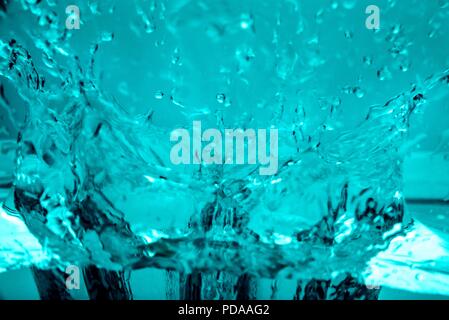 Water splash effect in blue with drops Stock Photo