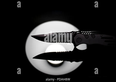 Combat knife used in the army. Survival knife use in close hand to hand military combat. Stock Photo