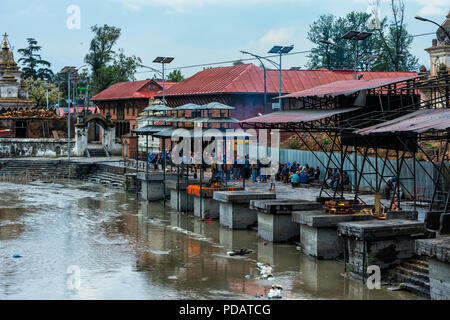 Cremation ghat along the Bagmati river, Pashupatinath Temple complex, Unesco World Heritage Site, Kathmandu, Nepal Stock Photo