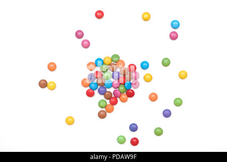 Multi colored sugar coated candies isolated on a white background Stock Photo