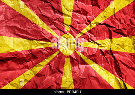 Macedonia flag painted on crumpled paper background Stock Photo