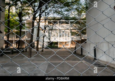 Chain link fence in front of the building Stock Photo