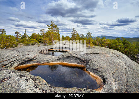 Beautiful Lake in the rocky mountains with pine wood of Karkaraly national park in Central Kazakhstan Stock Photo