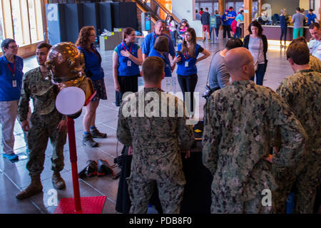 180802-N-SH284-0152 SEATTLE (August 02, 2018) Members of the Naval Station Everett dive locker interact with visitors at a static display held at the Seattle Aquarium during the 69th annual Seafair Fleet Week. Seafair Fleet Week is an annual celebration of the sea services wherein Sailors, Marines and Coast Guard members from visiting U.S. Navy and Coast Guard ships and ships from Canada make the city a port of call. (U.S. Navy photo by Mass Communication Specialist 2nd Class Vaughan Dill/Released) Stock Photo