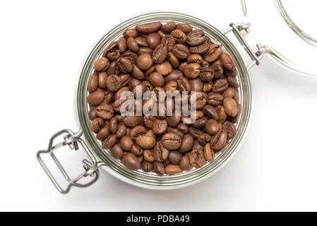 Roasted coffee beans in clip top storage jar viewed from above on white background Stock Photo