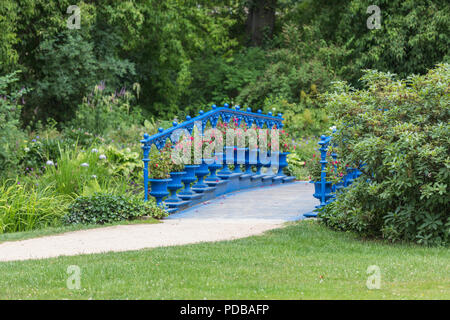 old blue bridge in the Fuerst Pueckler park in Bad Muskau Germany Stock Photo