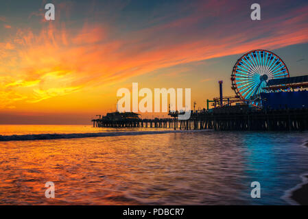 Visitors enjoy sunset above Santa Monica Pier in Los Angeles Stock Photo