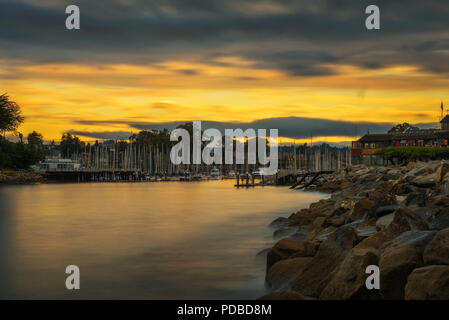 Sunrise above Santa Cruz harbor in Monterey bay, California. Long exposure. Stock Photo