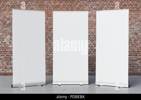 Three blank roll up banner stands with clipping path around banner poster. 3d rendering Stock Photo