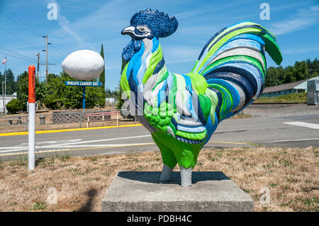 A large colorful chicken statue and  the "World's Largest Egg." Stock Photo
