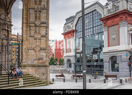 At left San Anton church and at right La Ribera market,  Old Town (Casco Viejo), Bilbao, Spain Stock Photo