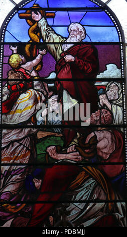 Victorian stained glass window depicting Moses lifting up the serpent in the wilderness. Stock Photo