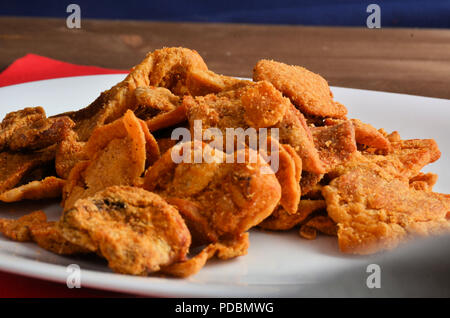 Pork rind favorite food in piedmonte italy, isolated on white in restaurant. Stock Photo
