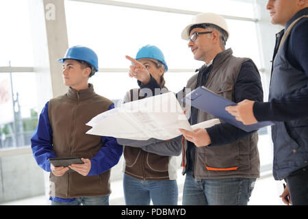 Instructor with young people in engineering training Stock Photo