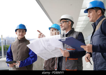 Instructor with young people in engineering training Stock Photo