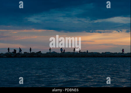 People wandering on the seafront at the town of Novigrad, Istria County, Croatia Stock Photo