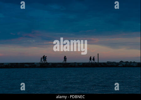 People wandering on the seafront at the town of Novigrad, Istria County, Croatia Stock Photo