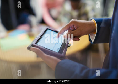 Close up businessman using digital tablet Stock Photo