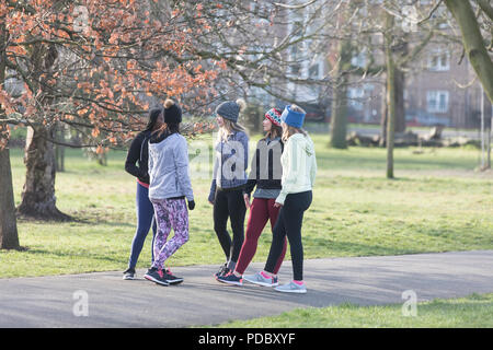 Female runners talking in park Stock Photo
