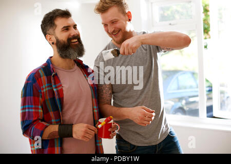Happy male gay couple painting Stock Photo