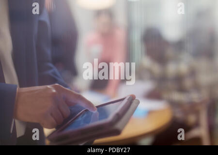 Close up businessman using digital tablet Stock Photo