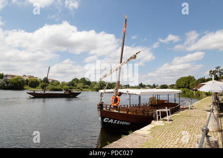 Two Gabarres or traditional boats on the Dordogne river at Bergerac for tourist boat trips; Bergerac, Dordogne, France Europe Stock Photo