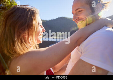 Affectionate, carefree couple hugging Stock Photo