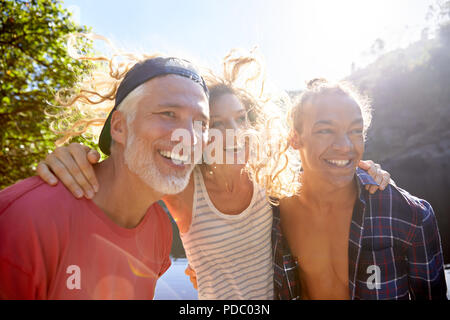 Portrait happy father with adult daughter and sun Stock Photo