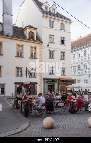 Kleines Cafe with outdoor seating in historic square, Vienna, Austria Stock Photo