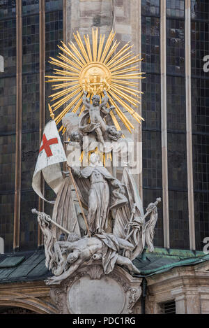 Statue with flag, St Stephen's Cathedral, Vienna, Austria Stock Photo