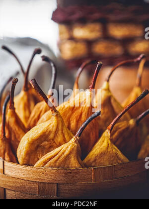 close-up shot of tasty dried pears in basket Stock Photo